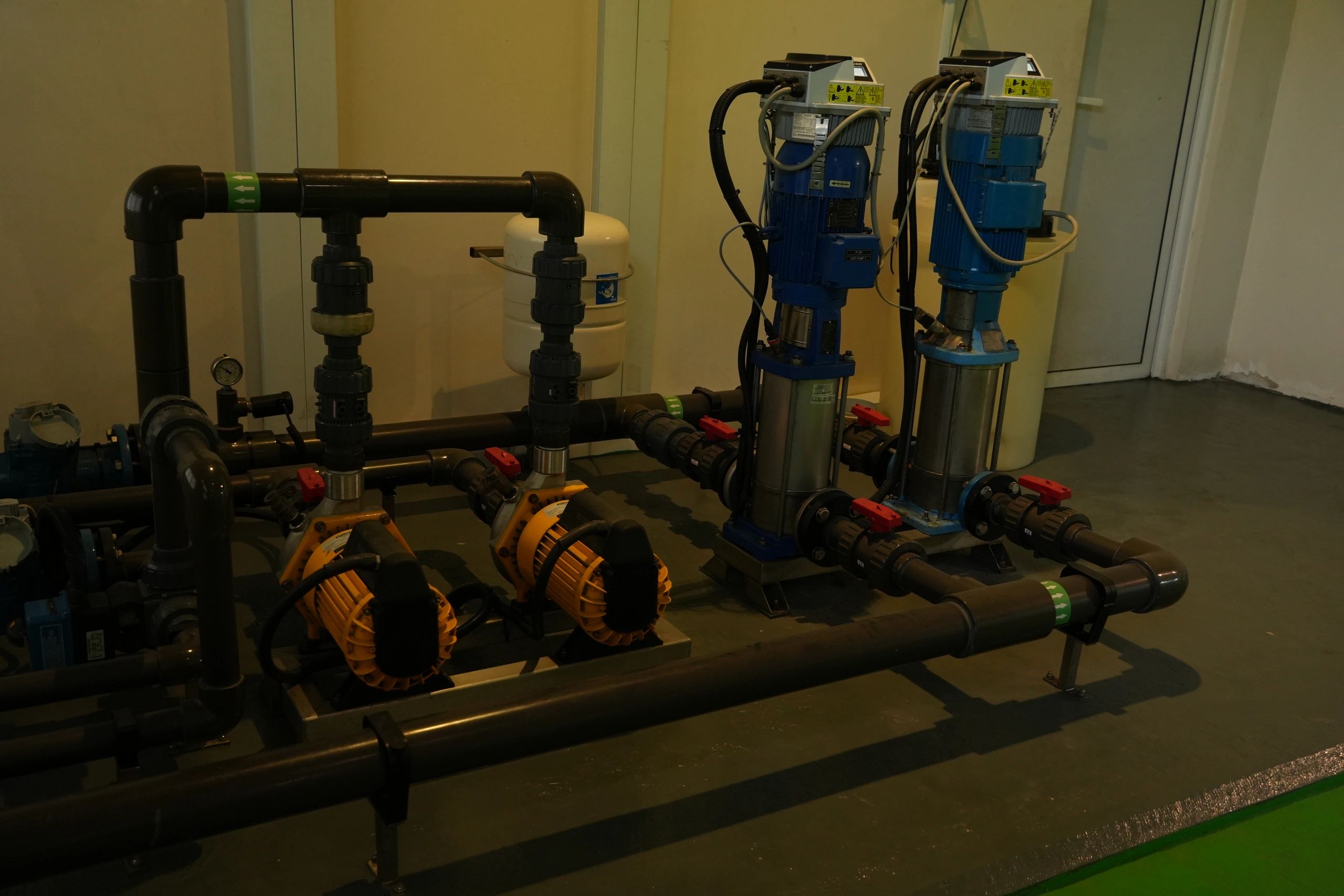 Water heater and plumbing system in a utility room